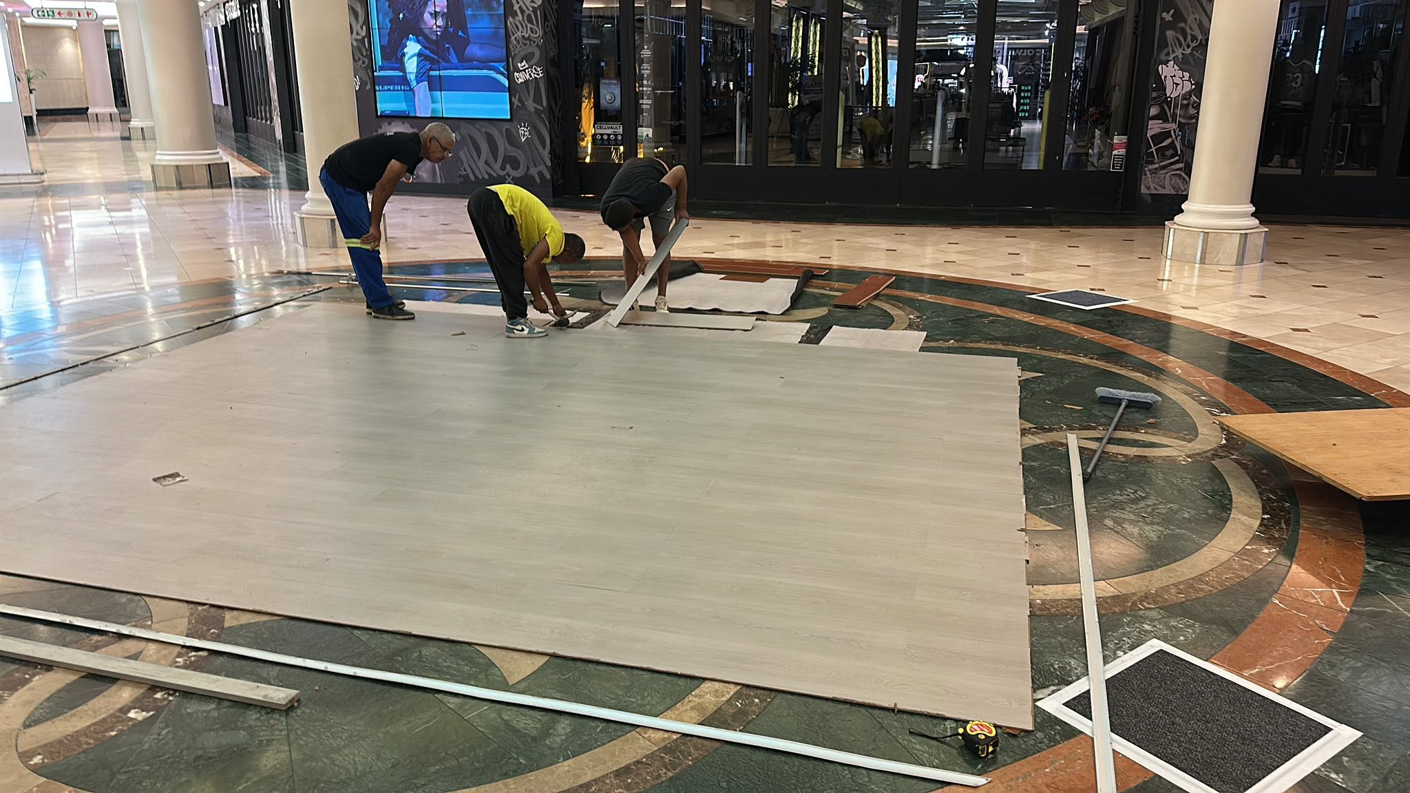 Team working on flooring installation